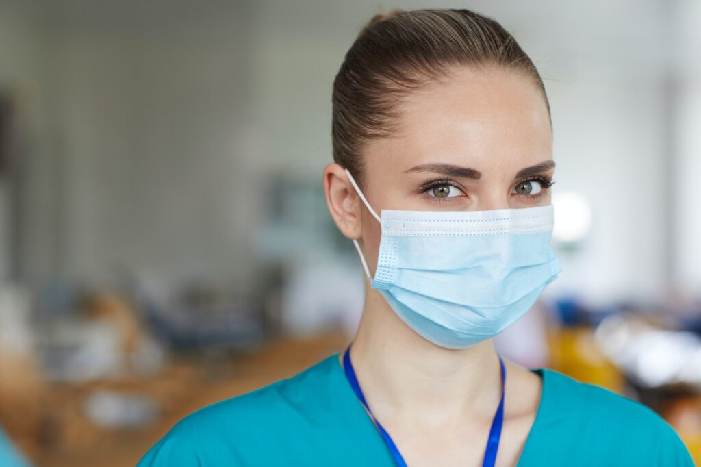 Young nurse in mask